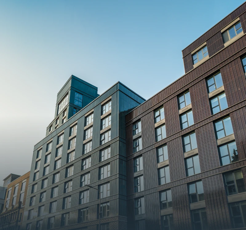 Modern multi-story building against clear sky.