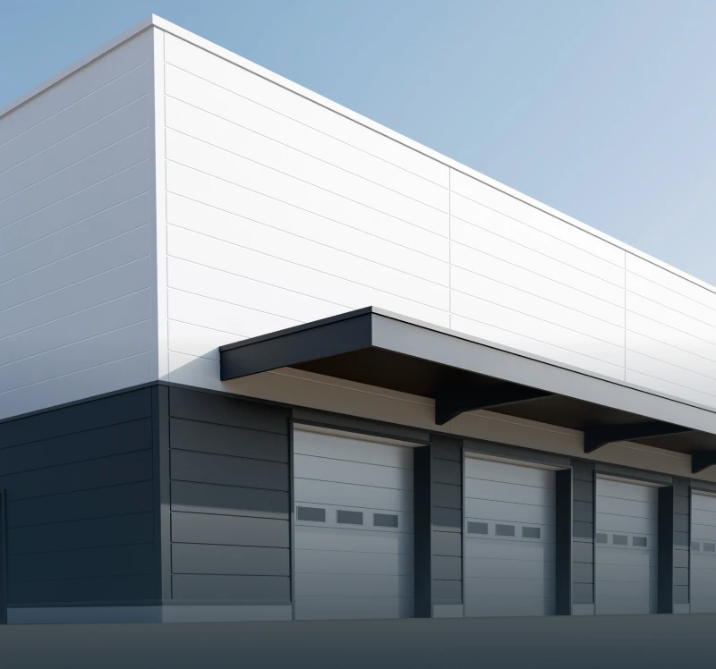 Modern industrial building with garage doors.