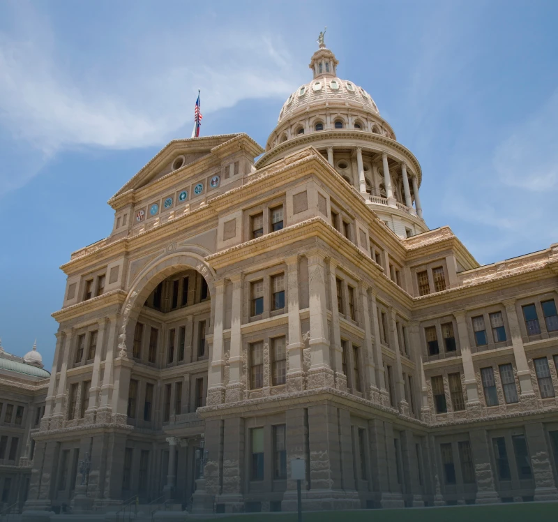 Capitol building with blue sky background.